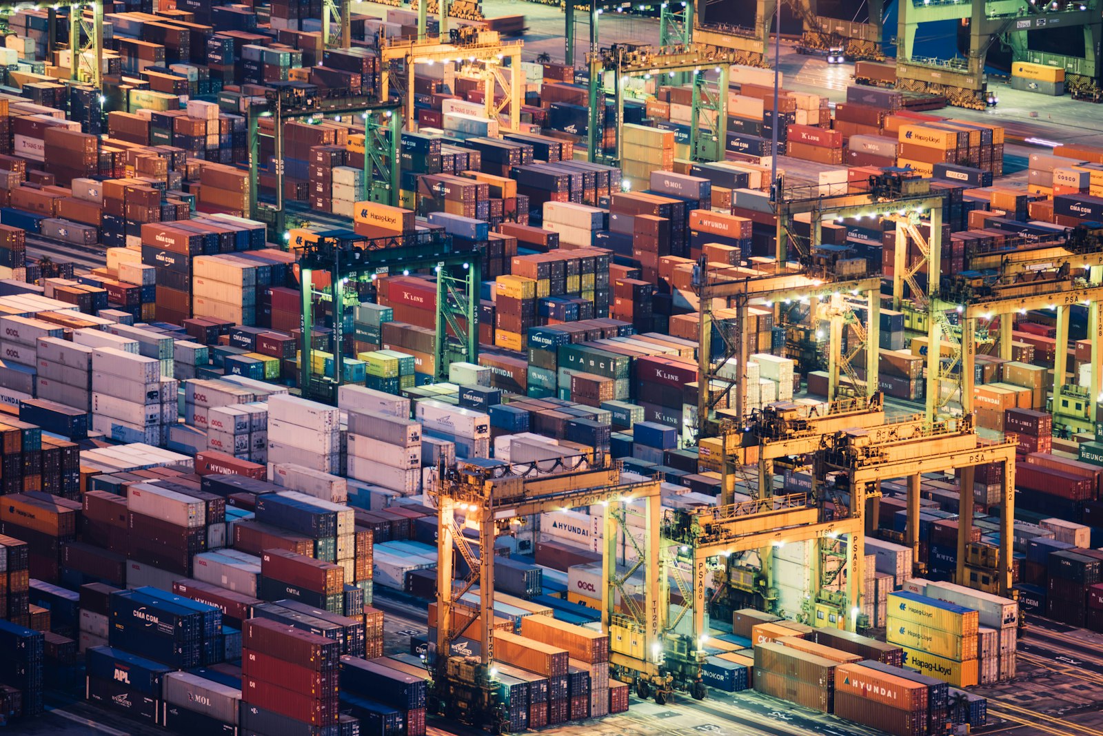 Colorful containers and cranes at a busy global trade terminal
